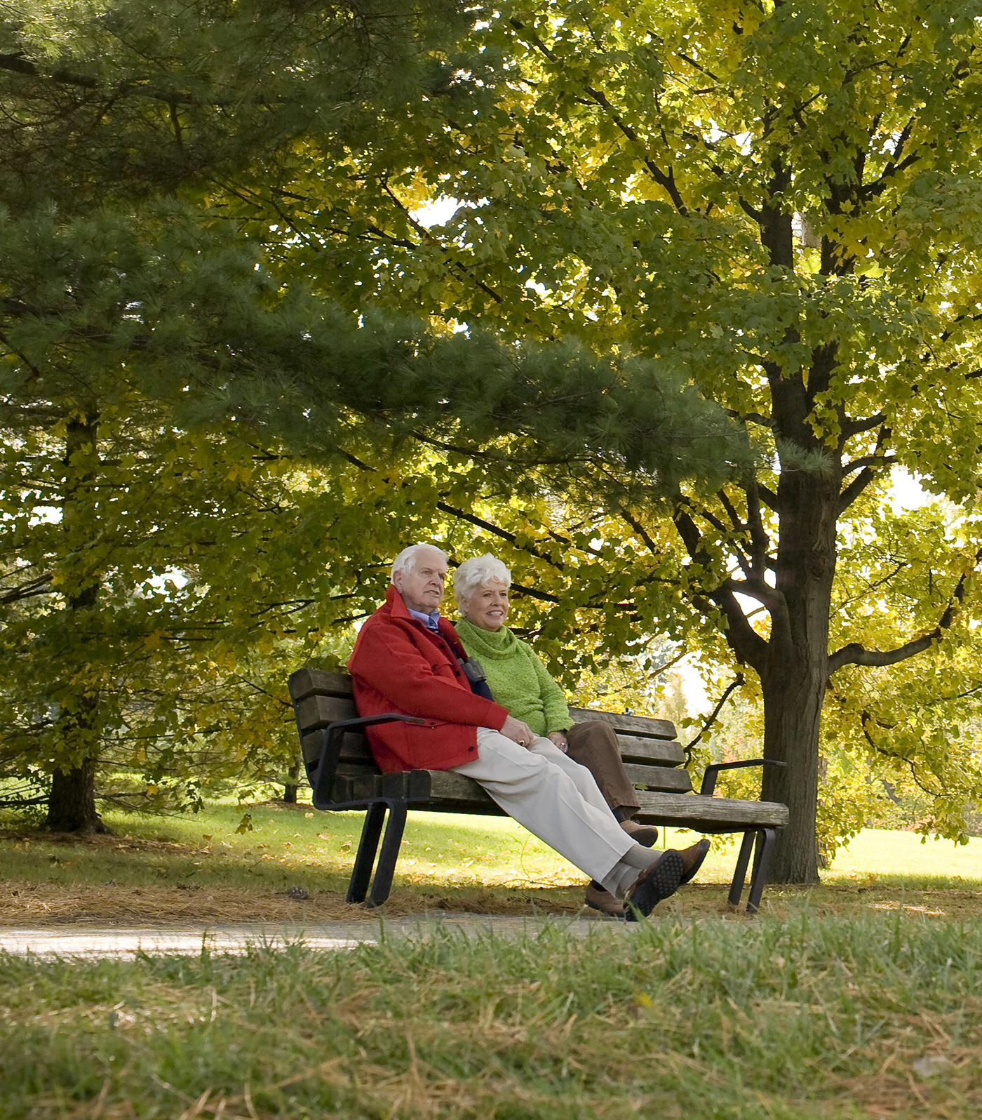 A man and woman sitting on a bench
